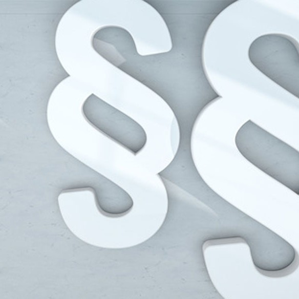 Weiße Paragraphen-Symbole auf grauem Hintergrund